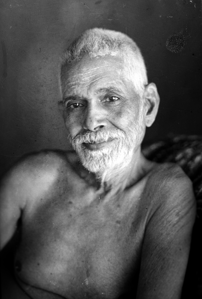 Ramana Maharshi seated in meditation